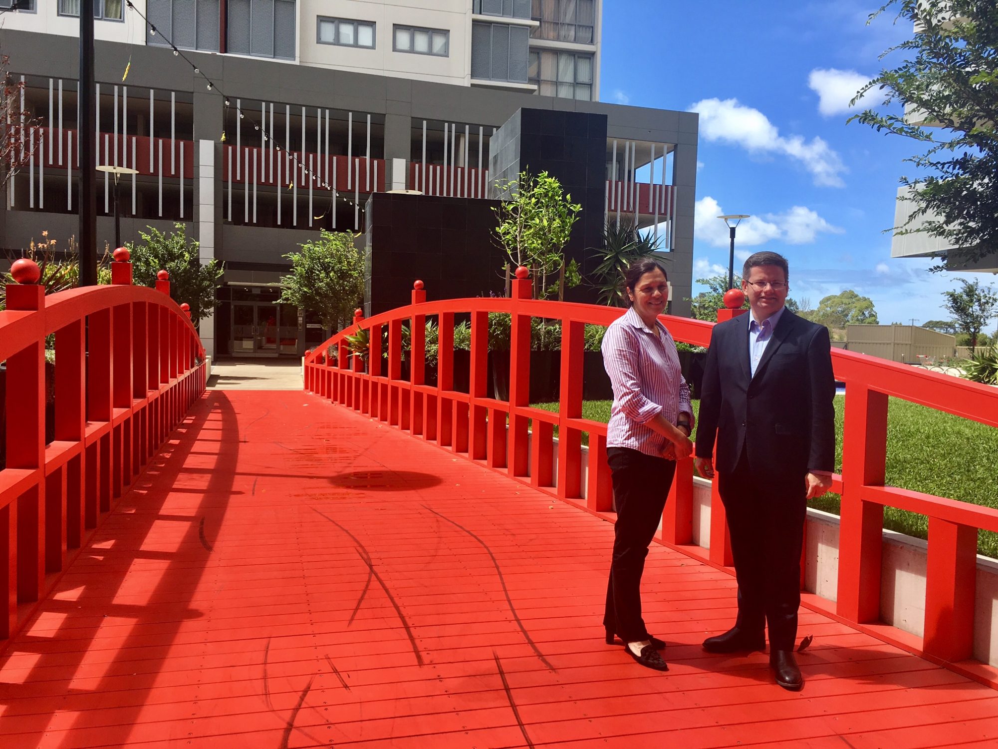 Civic CEO Annie Doyle shaking hands with Mark Coure MP (Member for Oatley)
