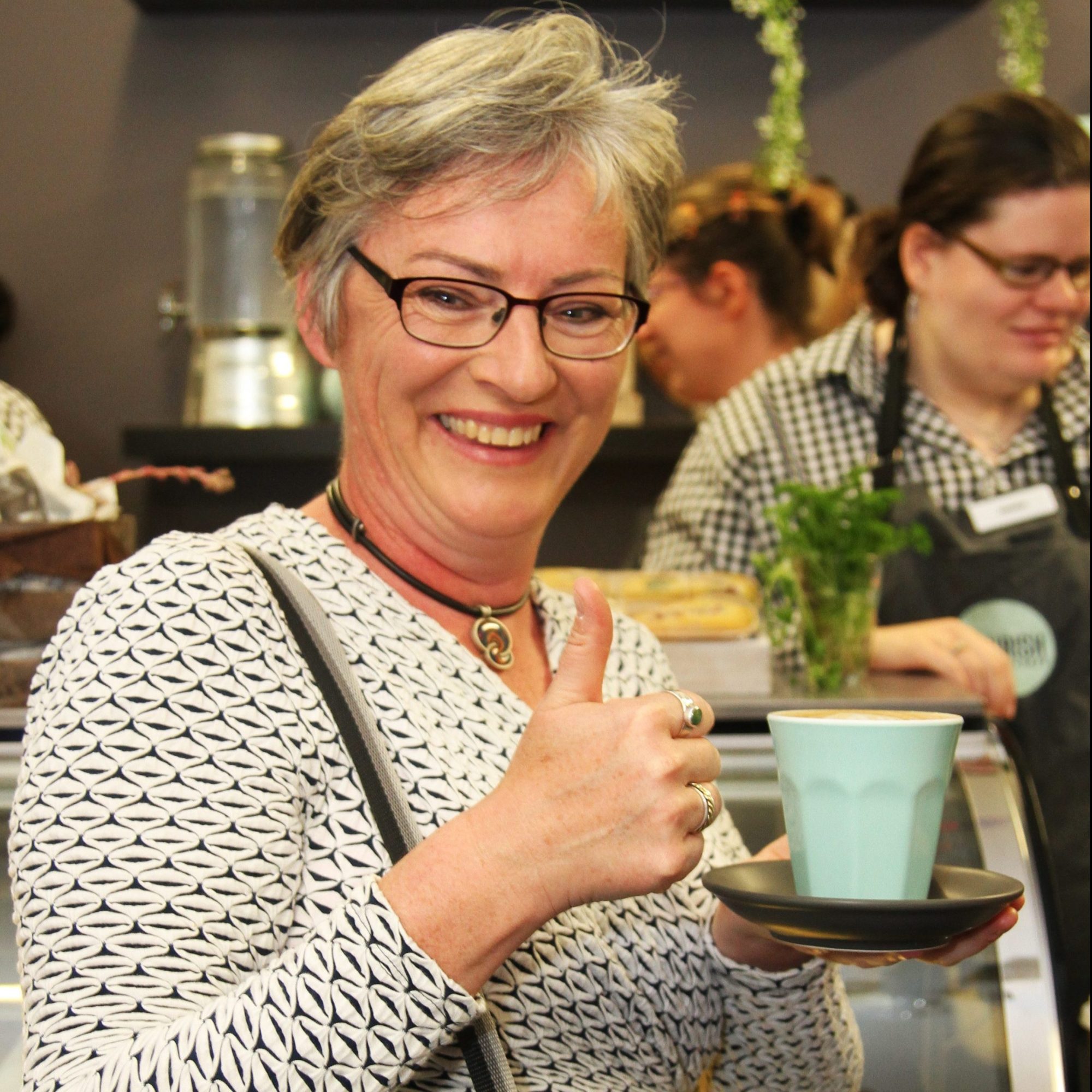 Customer enjoying a cup of coffee atCivic Kitchen & Catering Nowra
