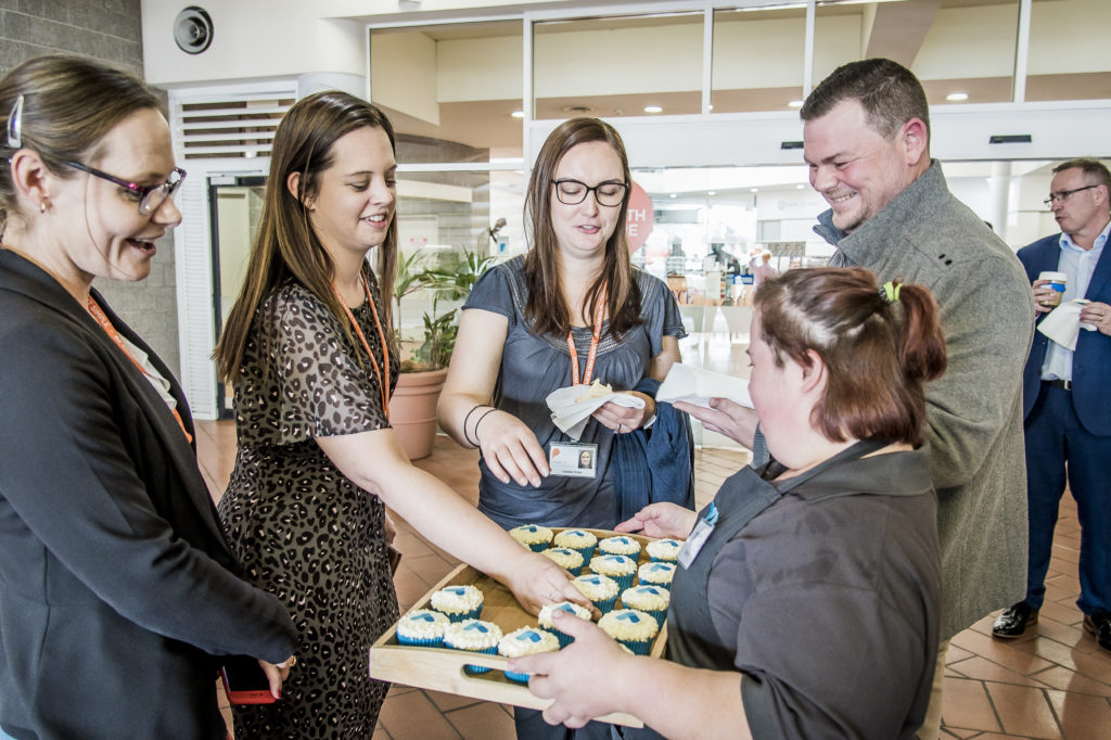 Civic Kitchen & Catering staff selling cupcakes. 