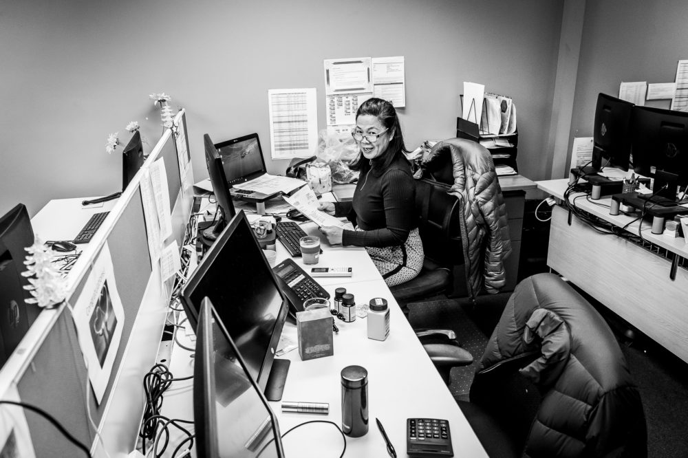 Civic office staff member sitting at her desk