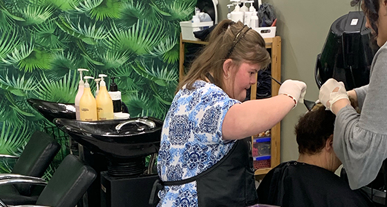 Kiera colouring hair in a salon.