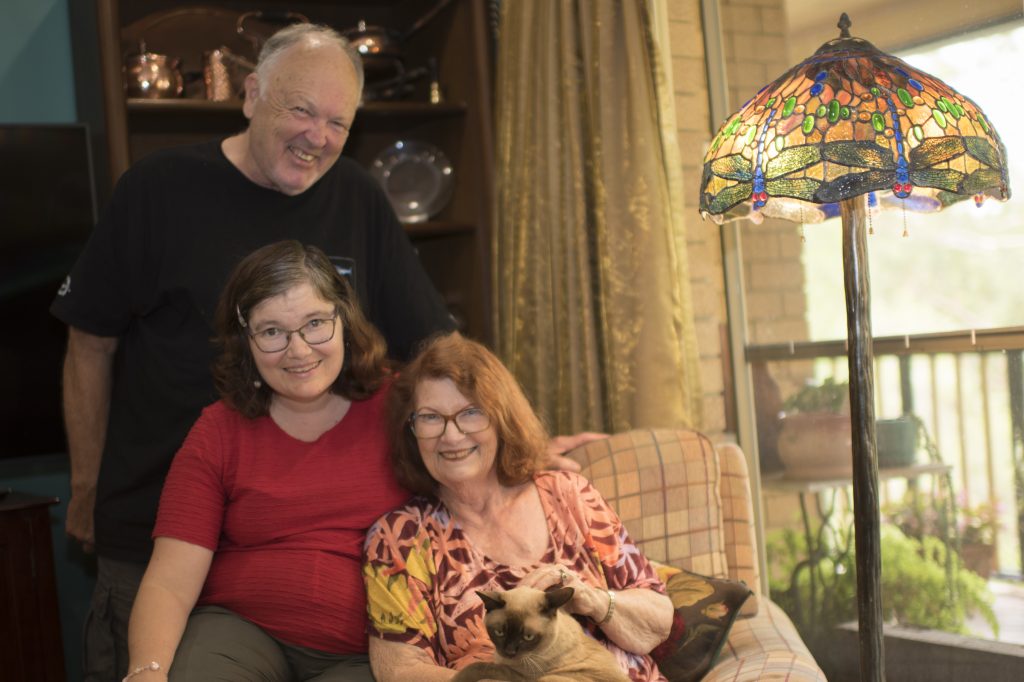 Civic disability accommodation client, Felicity (middle) with her Dad, Bob (top) and Mum, Robin (right)