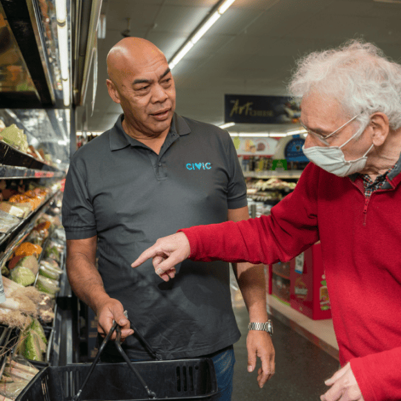Civic employee supporting a man with shopping