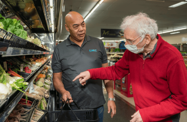 Civic employee supporting a man with shopping