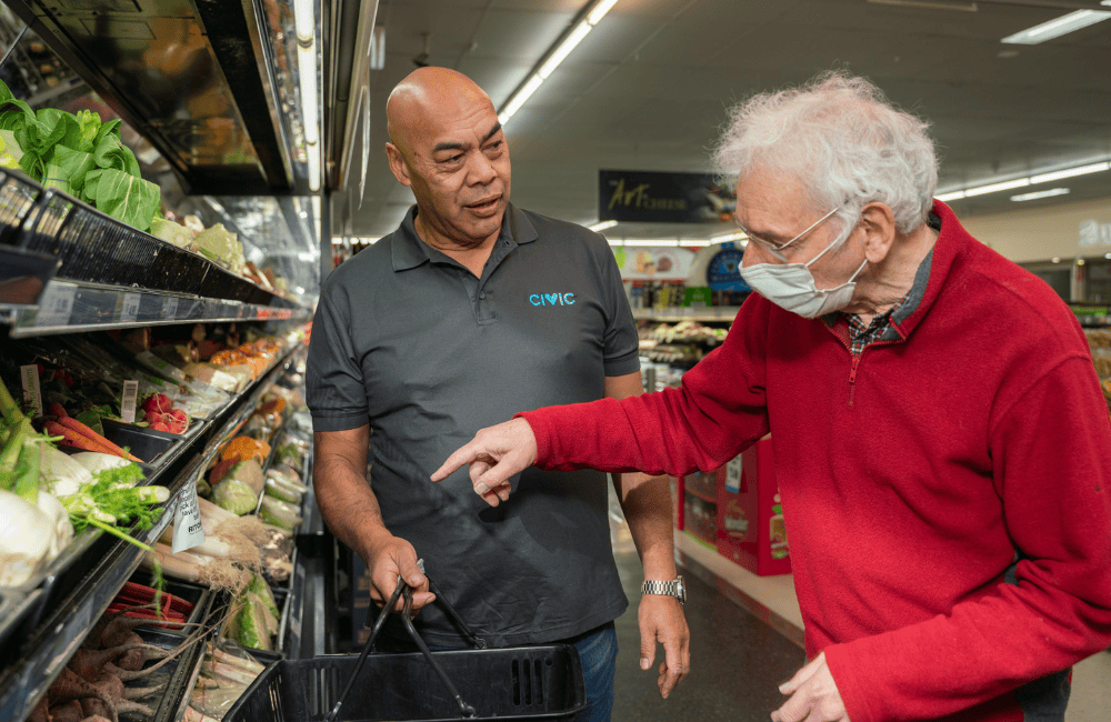 Civic employee supporting a man with shopping
