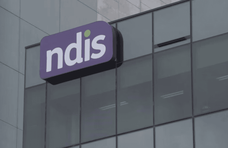 outside of NDIS office showing NDIS logo on building