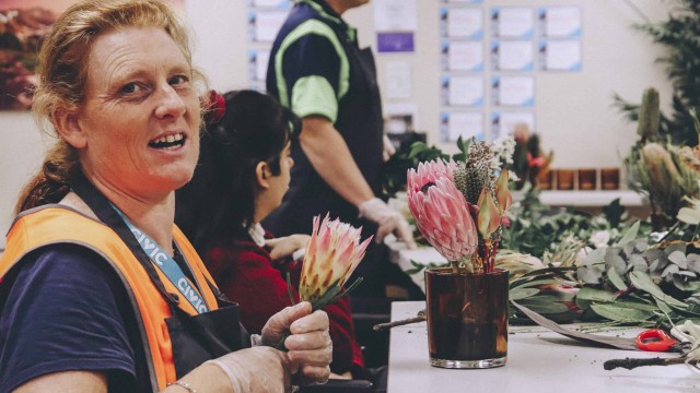 Civic crew hard at work arranging flowers with the Ring O’ Roses social enterprise